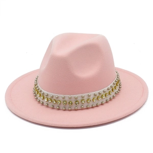 Detail of light pink fedora hat with rhinestone and silver rivet studded ribbon band