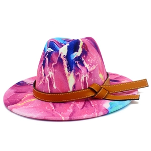 Close-up of pink and purple tie-dye wool fedora with brown leather decorative band