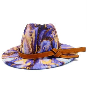 Detail of purple and gold marble tie-dye wool fedora with brown leather knotted band