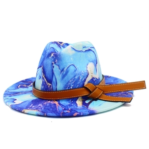 Detailed close-up of marble pattern wool fedora with brown leather decorative band