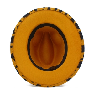 Detail view of yellow felt cowboy hat interior with leopard print brim and inner sweatband