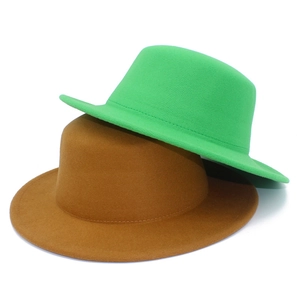 Flat top wool fedora hats in vibrant green and camel brown for autumn and winter seasons