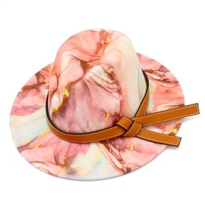 Detail of pink and orange marble pattern fedora hat with brown leather band
