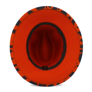 Internal view of orange wool felt fedora featuring black leopard print brim and sweatband