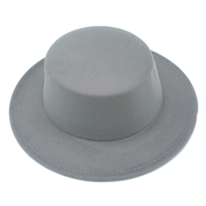 Top down view of grey wool felt boater hat showing fine texture and stitched brim detail