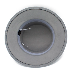 Detail of wool felt fedora interior with adjustable drawstring and 65% polyester label