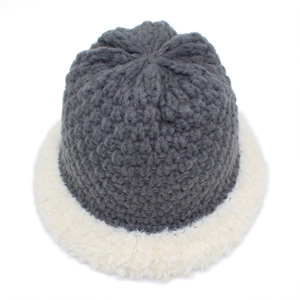 Winter knit bucket hat in dark grey and white plush patchwork style with warm ear protection