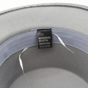 Detail view of the gray wool fedora showing the wash label and internal fabric texture