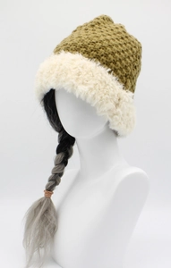 Detail of winter knit bucket hat with olive green yarn and white faux fur trim on brim