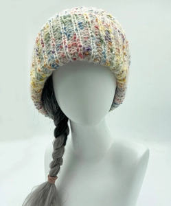 Detailed close-up of rainbow flecked chunky knit winter bucket hat with thick texture