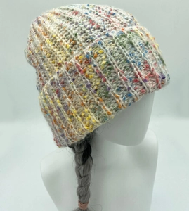 Detailed view of white tweed knit bucket hat with colorful flecks and ribbed texture