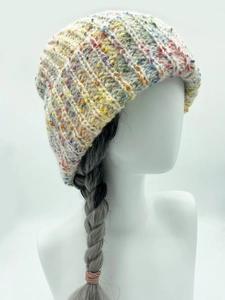 Detail of multi-color thick knit beanie with rib pattern and rainbow speckled texture
