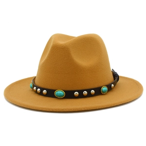 Detail of camel wool fedora hat featuring black leather band with turquoise and gold studs