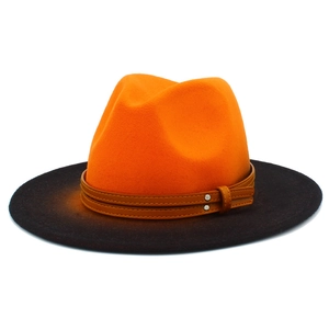Close-up of orange crown and black brim fedora with studded leather hat band