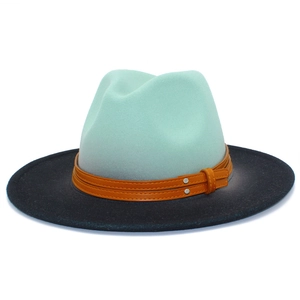 Detail view of two-tone fedora hat in mint green and black with leather band and rivets