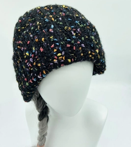 Close-up of black knit beanie with colorful flecks and soft wool texture detail