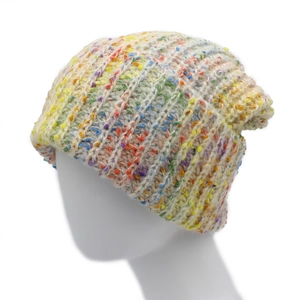 Detailed close-up of rainbow knit beanie showing thick texture and mixed yarn pattern
