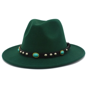 Close-up of dark green fedora hat featuring black leather band with turquoise and silver studs