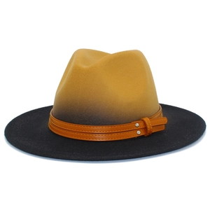 Detail view of two-tone gradient fedora with brown leather strap and silver metal studs