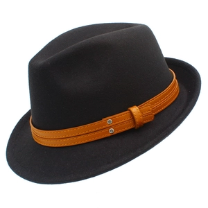 Detail of black wool fedora hat featuring a brown leather strap with silver rivets