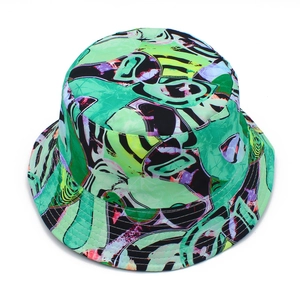 Close-up of vibrant green abstract fluid print bucket hat with reinforced stitching on brim