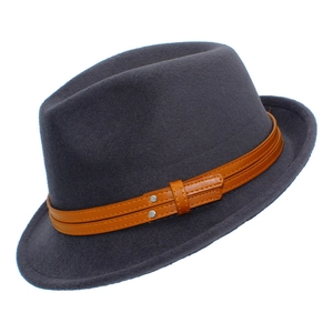 Macro detail of the dark grey felt fedora hat with brown leather band and metallic buckle