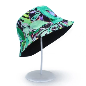 Close-up of abstract artistic graffiti print on green bucket hat with vibrant neon details