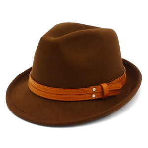 Close-up of brown wool fedora hat featuring decorative leather bands and metal buckles
