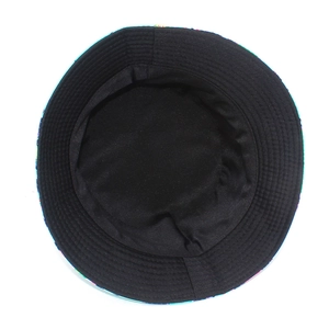 Detail view of cotton bucket hat featuring black inner lining and colorful cartoon prints