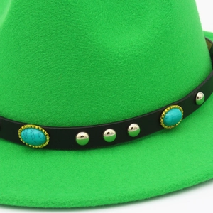 Detail of bright green felt fedora hat featuring black leather belt and turquoise inlay