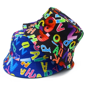 Streetwear bucket hats in black and blue with vibrant all-over colorful letter prints