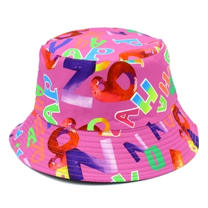Detailed view of pink bucket hat featuring colorful graffiti alphabet print and neat stitching