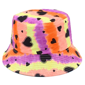 Detailed view of colorful tie-dye bucket hat featuring black heart patterns and vibrant gradients