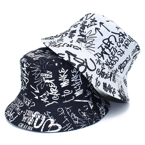 Fashionable bucket hat with graffiti letter print in black and white canvas fabric
