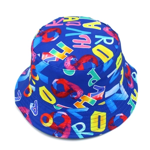 Detail view of the colorful graffiti letter patterns on this navy blue bucket hat surface