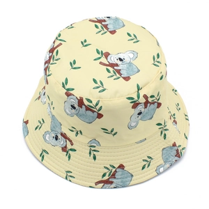 Close-up of yellow bucket hat with cute koala pattern and reinforced stitching details