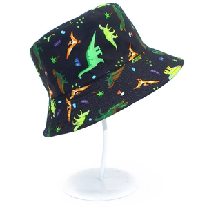 Detail of children's reversible sun hat with colorful dinosaur patterns on black canvas