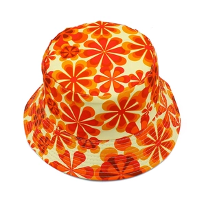 Detailed top view of retro bucket hat showing orange floral patterns and flat brim stitching