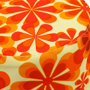 Detailed close-up showing vibrant vintage floral canvas texture and durable stitching