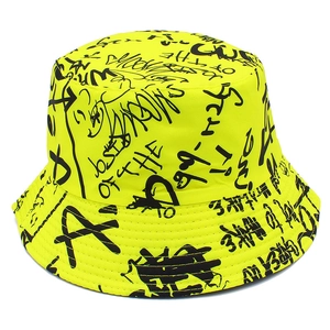 Neon yellow bucket hat featuring black street style graffiti print and flat top brim