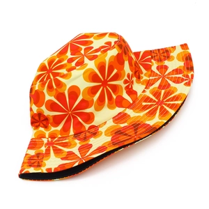 Detail of vintage floral bucket hat with orange pattern and high quality stitching