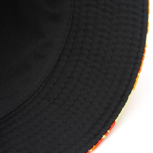 Close-up of the reinforced stitching and black inner lining of the bucket hat