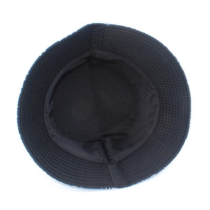 Detail of the bucket hat featuring black lining and reinforced concentric stitching on brim