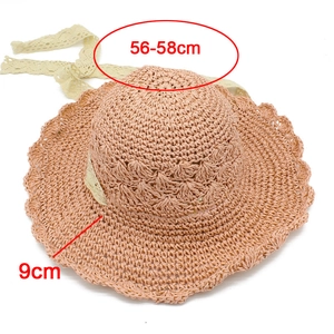 Detail of pink woven sun hat featuring lace floral ribbon and 9cm wavy brim edge
