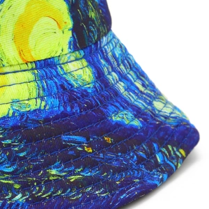Close-up detail of Starry Night oil painting print and reinforced stitching on sun hat