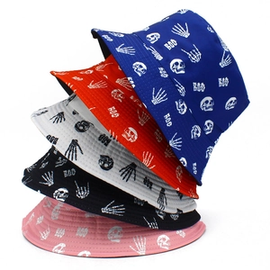 Stack of colorful skull pattern bucket hats in black, red, pink, white, and navy blue