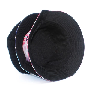 Close-up of pink coconut print bucket hat showing black inner lining and stitching