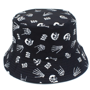 Close-up of black bucket hat featuring white Halloween skull and BOO graphic embroidery