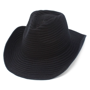 Detailed close-up of high-quality black knitted fedora hat with dense woven texture