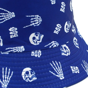Close-up of durable navy cotton bucket hat featuring white skull and BOO prints